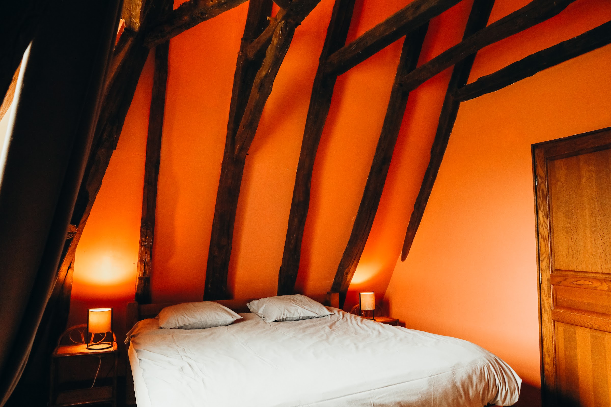 Chambre sous poutres apparentes